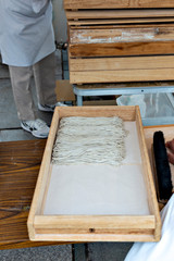 Soba making, cutting the dough to noodle