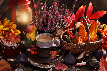 Obraz na płótnie Canvas autumn decoration and cup of coffee