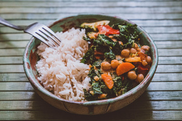 Healthy food: rice with curry (curly kale, paprika, carrots, chickpeas, zucchini, broccoli)