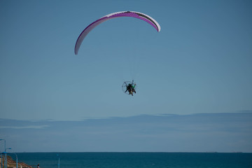 Paraglider in the blue skies