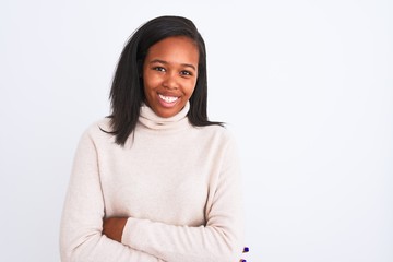 Beautiful young african american woman wearing turtleneck sweater over isolated background happy face smiling with crossed arms looking at the camera. Positive person.