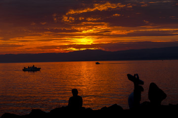 Sunset in Lausanne harbour around the district of Ouchy. Travel concept
