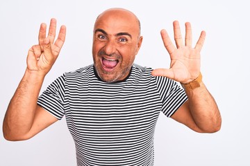 Fototapeta premium Middle age handsome man wearing striped navy t-shirt over isolated white background showing and pointing up with fingers number eight while smiling confident and happy.