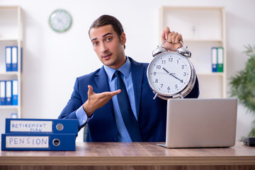 Young male accountant working in the office