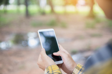 Closeup of hand using smartphone with effects