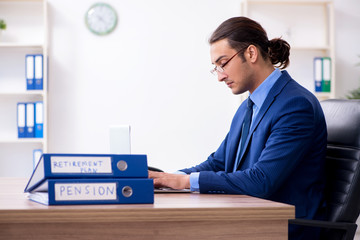 Young male accountant working in the office