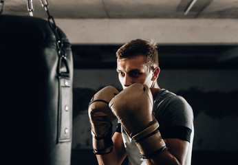 Young boxer in gloves