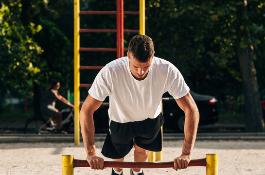 Sport men doing push-ups during outdoor crossfit training workout