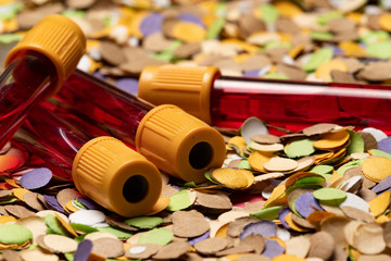 donate blood during the carnival. Confetti Background with Blood Tubes