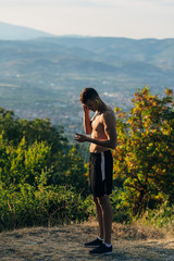 Young man prepare for running through the mountain