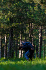 Fototapeta premium A couple of young man in overall and woman dancing hip-hop in the forest