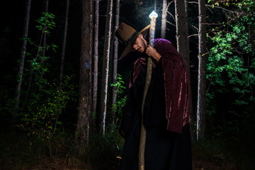 Wizard cosplay for Halloween in the forest