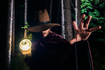 Cosplayer in a wizard costume in the forest