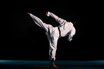 Foto op Aluminium Portrait of a martial arts master on the black background © qunica.com
