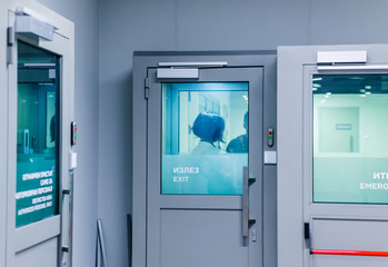Fototapeta premium Security personnel outside of exit door