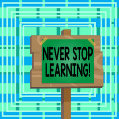 Text sign showing Never Stop Learning. Business photo text keep on studying gaining new knowledge or materials Wood plank wooden stick pole paper note attached adhesive tape empty space