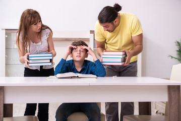 Parents helping their son to prepare for school