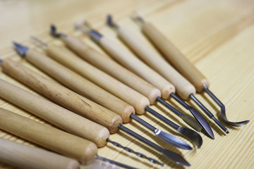 Set of sculpture tools of wood and metal with different tips and shapes