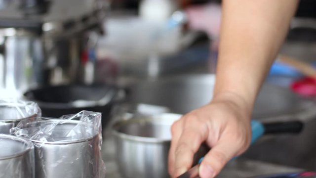 4k close up asian chef cooking noodles, pouring hot soup, noodles bowl, lunch, meatball stewed beef, clear soup, restaurant