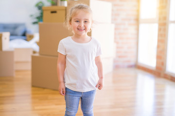 Beautiful toddler child girl wearing white t-shirt standing with happy face