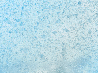 Fototapeta na wymiar Frost pattern on winter glass. Ice texture on the window