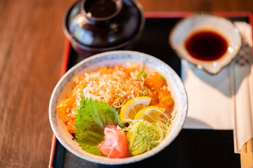 Salmon bowl with miso soup and delicious soy sauce