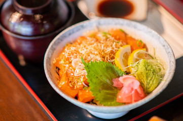 Salmon bowl with miso soup and delicious soy sauce