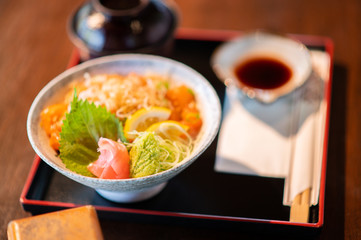 Salmon bowl with miso soup and delicious soy sauce