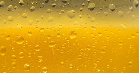 Droplets on freshly poured beer detail macro delicious unfocused