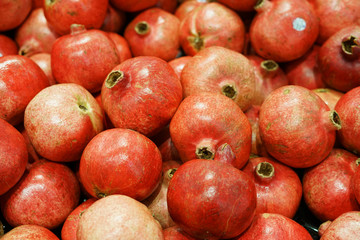 fresh pomegranate in pile as food background