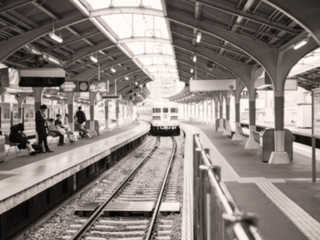 Abstract blur background of people waiting for train arriving on platform in Japan
