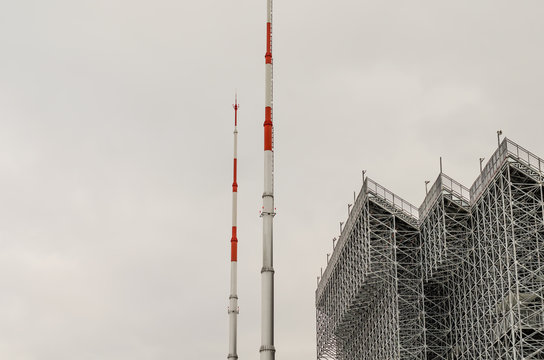 Two high lightning rods in the stadium.