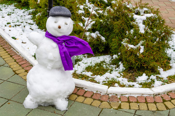 Snowman in hat and scarf