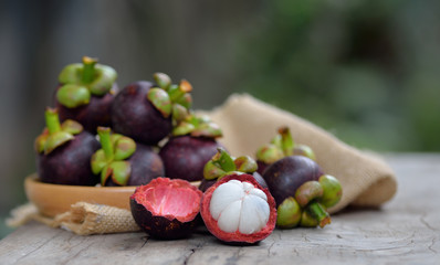 Mangosteen fruit on a wooden table.