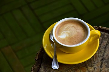 Cup of hot coffee on the wooden floor in the morning