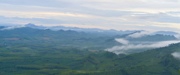 Beautiful sky cloud and fog above green mountains. Wangpamek, Trang, Thailand.