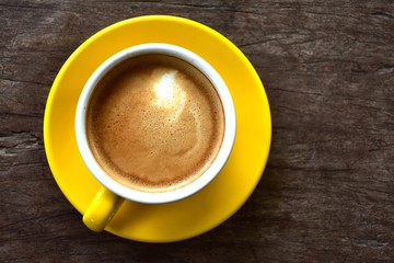 Cup of hot coffee on the wooden floor in the morning