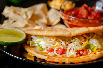 Close up Homemade Baja beef Tacos salad with tomato Salsa and Chips - mexican food