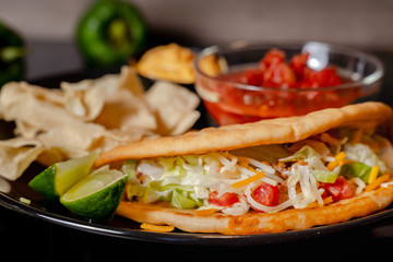 Close up Homemade Baja beef Tacos salad with tomato Salsa and Chips - mexican food