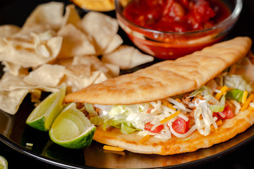 Close up Homemade Baja beef Tacos salad with tomato Salsa and Chips - mexican food