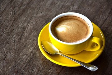 Cup of hot coffee on the wooden floor in the morning