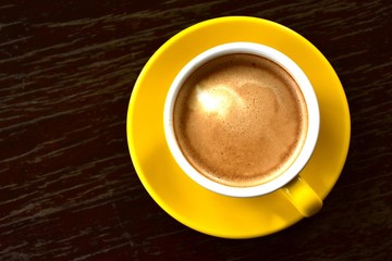Cup of hot coffee on the wooden floor in the morning