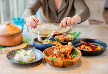 woman cutting vegetables in kitchen