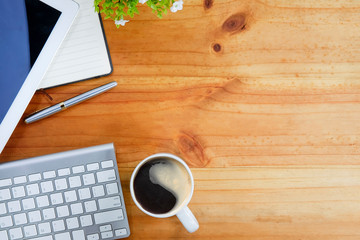 Top view office stuff with notepad, laptop and coffee cup mouse notepad shot.blank screen mobile phone and supplies on white desk workspace and copy space.