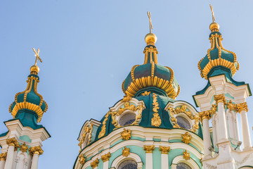 Domes of St. Andrew's Church, designed by architect Rastrelli, Kiev, Ukraine, sunny autumn day.	