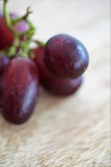 fresh grapes on wooden table