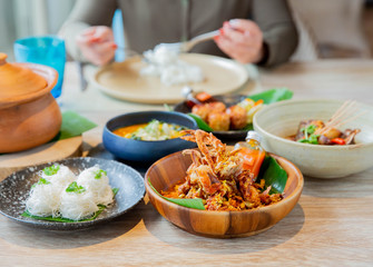 A woman eating sea food in Thai cousin