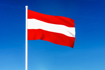 Fototapeta na wymiar Waving flag of Austria on the blue sky background