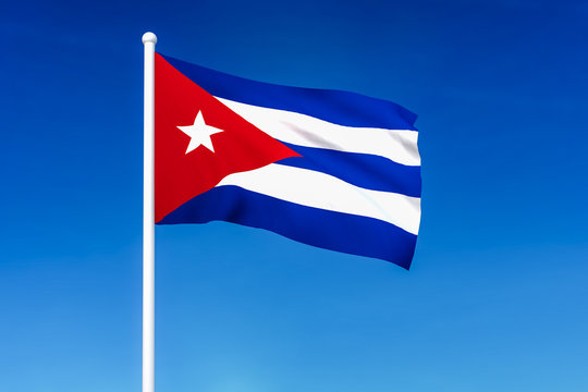 Waving flag of Cuba on the blue sky background