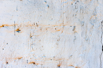 Texture of a concrete wall with cracks and scratches which can be used as a background